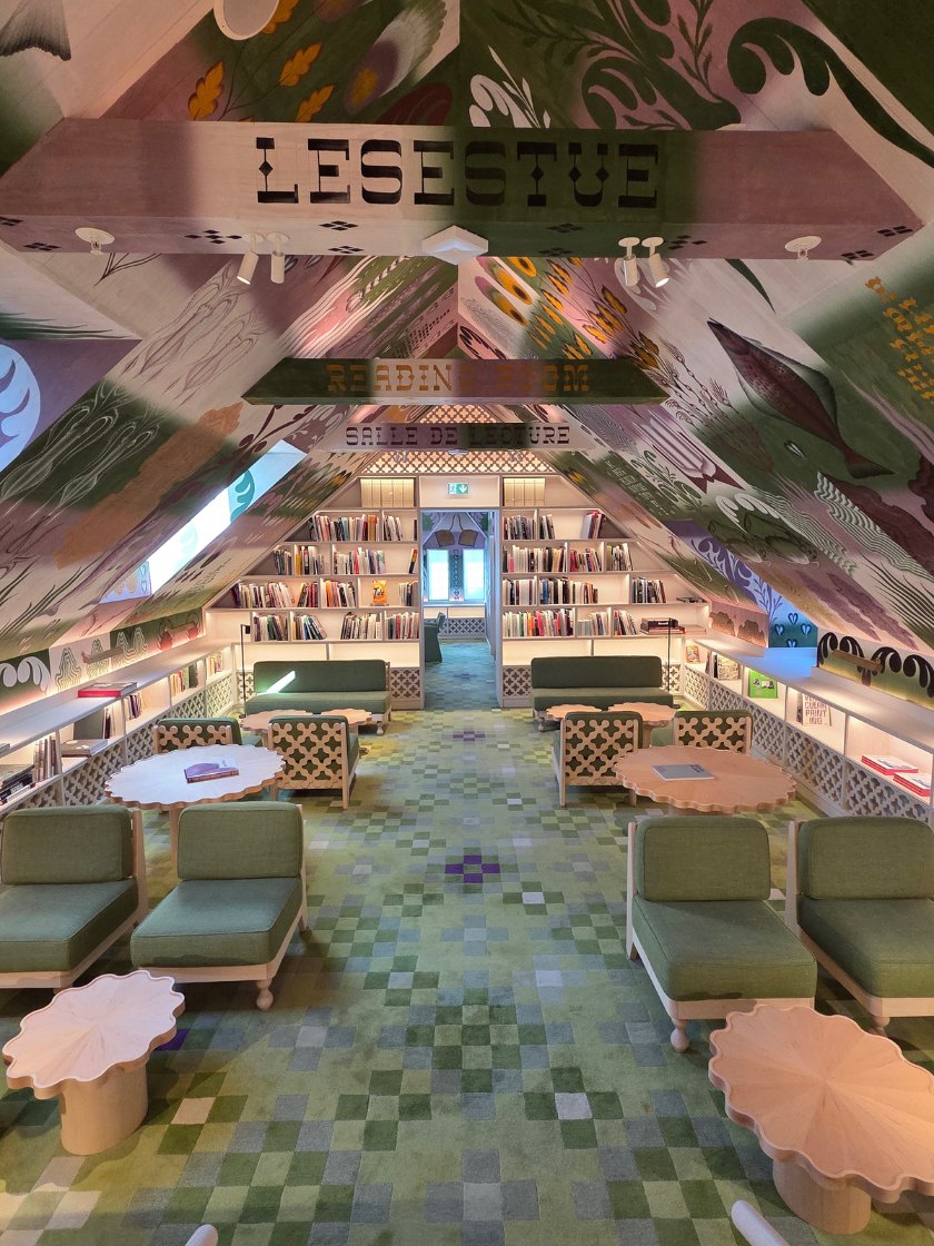 PoMo’s reading room in Trondheim features a ceiling decorated with rosemaling-inspired designs.