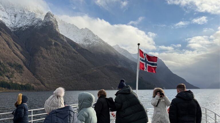 Tourists on a boat trip along Norway's Hjørundfjord. Photo: David Nikel.