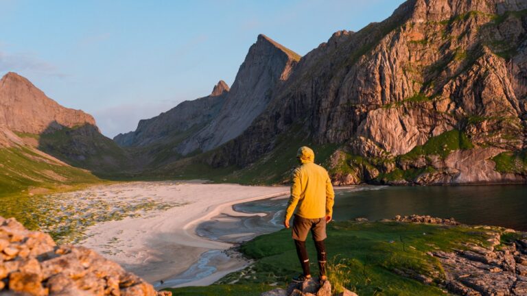 Hiker on Bunes Beach in Lofoten.