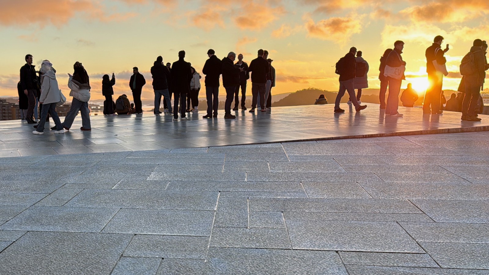 Crowd at Oslo Opera House watching a sunset. Photo: David Nikel.