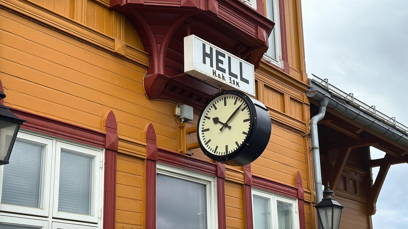 Hell railway station sign and clock.