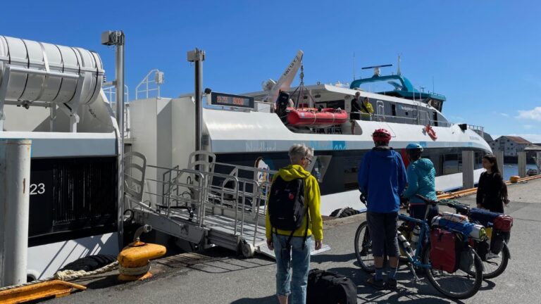 Passengers and cyclists waiting for ferry from Svolvær to Bodø. Photo: David Nikel.