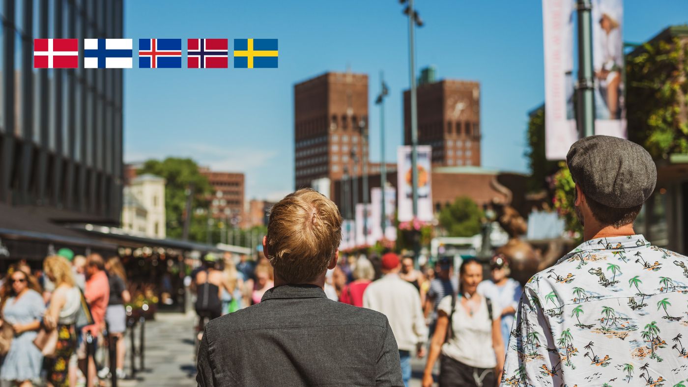 Crowds on Aker Brygge with the flags of the Nordic countries.