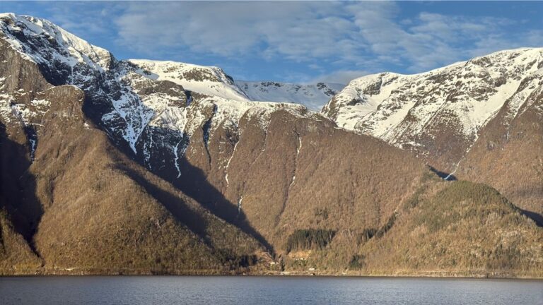 Dramatic fjord landscape with snow cap mountains. Photo: David Nikel.
