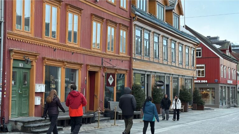 People walking along the Main Street in Tromsø. Photo: David Nikel.